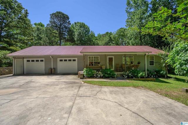 3628 Oscar Bradford Rd, Hayden, AL 35079 - ranch-style house with concrete driveway, a garage, a porch, and metal roof