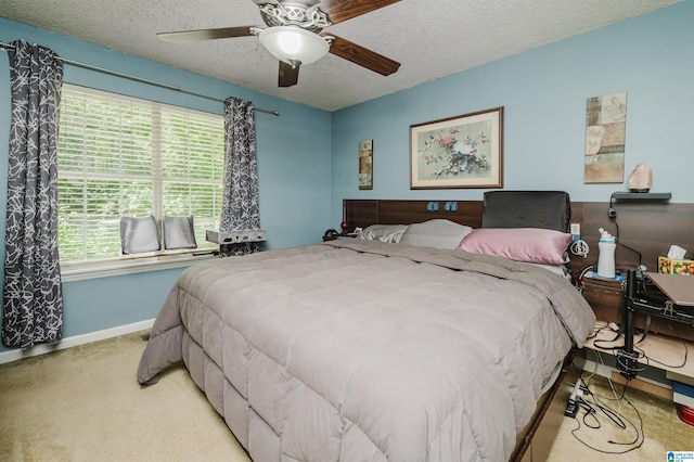 3628 Oscar Bradford Rd, Hayden, AL 35079 - carpeted bedroom featuring a textured ceiling, baseboards, and ceiling fan