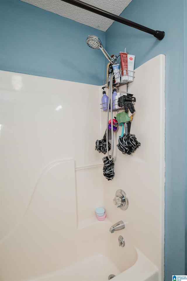 3628 Oscar Bradford Rd, Hayden, AL 35079 - full bathroom with washtub / shower combination and a textured ceiling