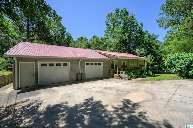 3628 Oscar Bradford Rd, Hayden, AL 35079 - view of front facade with driveway, a garage, and metal roof
