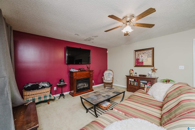 3628 Oscar Bradford Rd, Hayden, AL 35079 - living area with ceiling fan, carpet, a fireplace, a textured ceiling, and baseboards