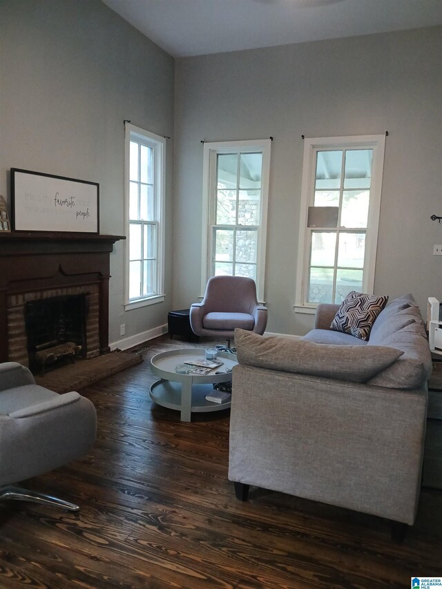 2120 Brewster Rd, Birmingham, AL 35235 - living area with dark wood-style flooring and a fireplace