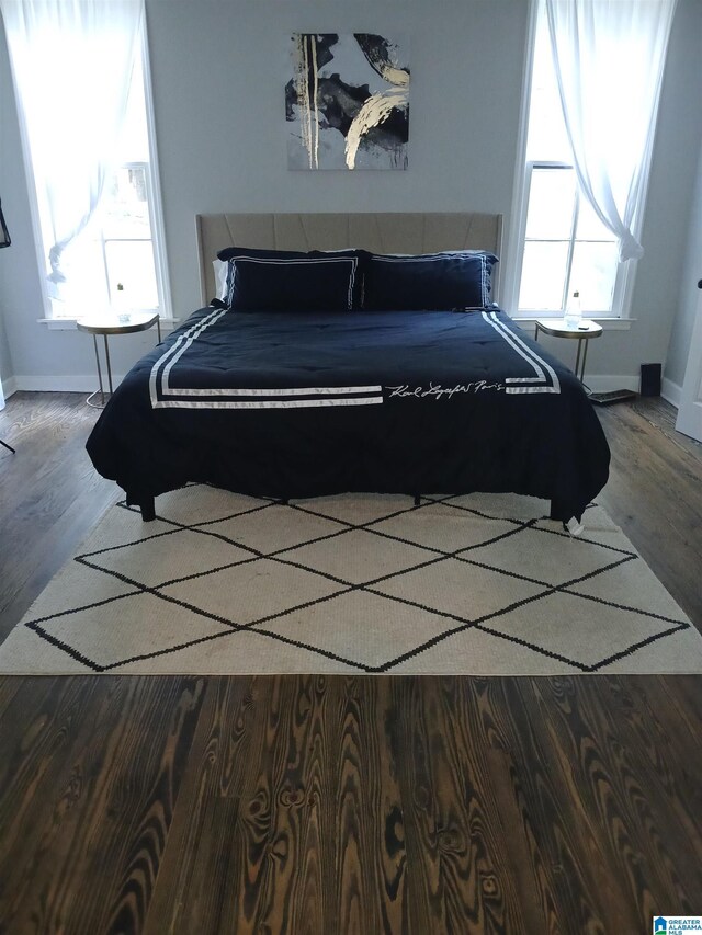 2120 Brewster Rd, Birmingham, AL 35235 - bedroom featuring wood finished floors and baseboards