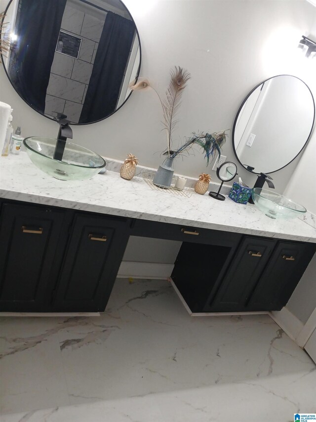 2120 Brewster Rd, Birmingham, AL 35235 - full bath with vanity and marble look tiles