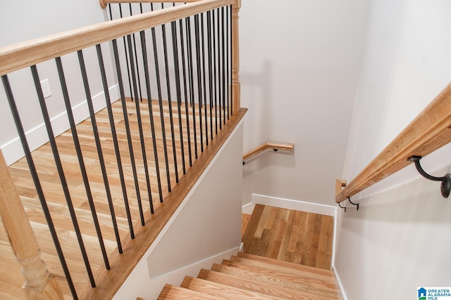 126 Harbor Pointe Dr, Talladega, AL 35160 - stairway featuring wood finished floors and baseboards