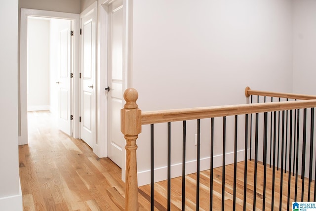 126 Harbor Pointe Dr, Talladega, AL 35160 - hall featuring wood finished floors and an upstairs landing