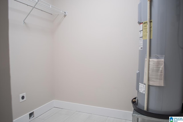 126 Harbor Pointe Dr, Talladega, AL 35160 - laundry area featuring water heater and electric dryer hookup