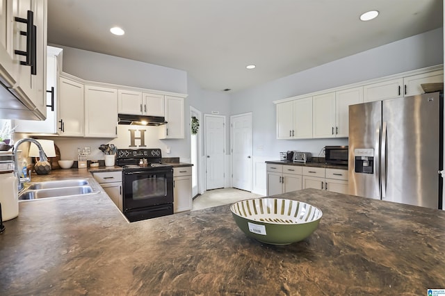 1206 Savannah Ln, Calera, AL 35040 - kitchen featuring black appliances, under cabinet range hood, a sink, dark countertops, and white cabinetry