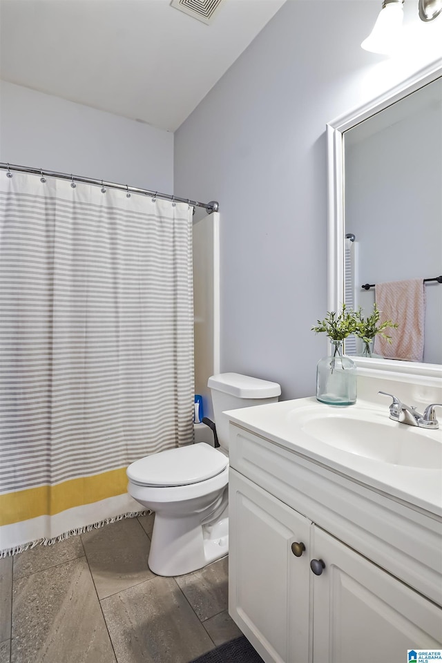 1206 Savannah Ln, Calera, AL 35040 - bathroom with vanity, toilet, and a shower with curtain