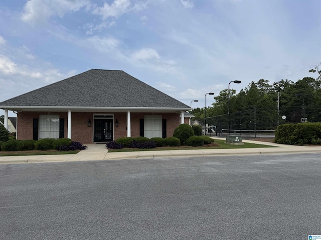 1206 Savannah Ln, Calera, AL 35040 - view of front of house featuring brick siding and roof with shingles