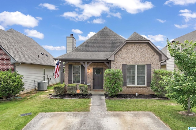 1206 Savannah Ln, Calera, AL 35040 - view of front of property with brick siding, a front yard, and a chimney