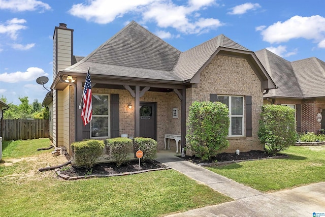 1206 Savannah Ln, Calera, AL 35040 - view of front of house featuring a chimney, brick siding, and a shingled roof