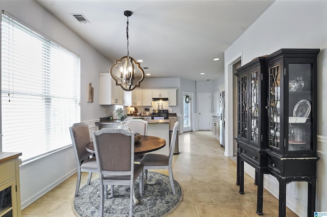 1206 Savannah Ln, Calera, AL 35040 - dining room featuring a chandelier, light tile patterned floors, baseboards, and recessed lighting