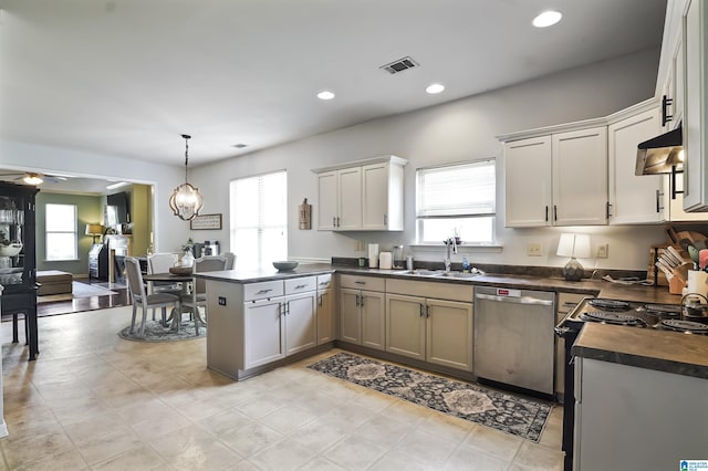 1206 Savannah Ln, Calera, AL 35040 - kitchen with stainless steel dishwasher, a sink, range with electric stovetop, a peninsula, and under cabinet range hood