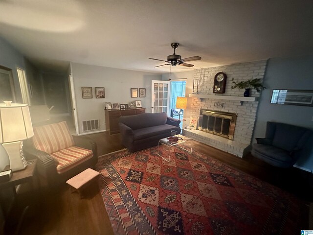 400 Shiloh Cir, Birmingham, AL 35213 - living room featuring wood finished floors, a ceiling fan, a brick fireplace, and baseboards