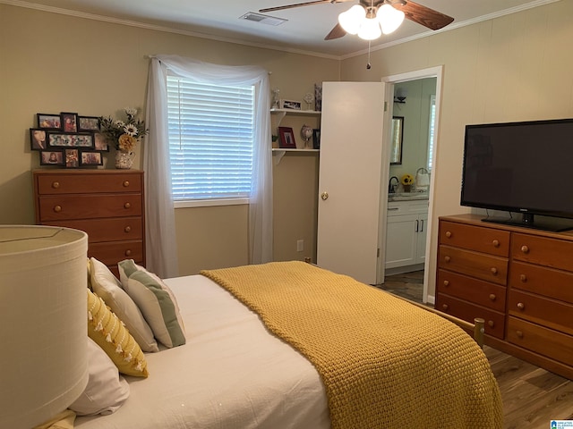 5769 Eastern Valley Rd, Mccalla, AL 35111 - bedroom featuring wood finished floors, ornamental molding, ensuite bathroom, a ceiling fan, and a sink