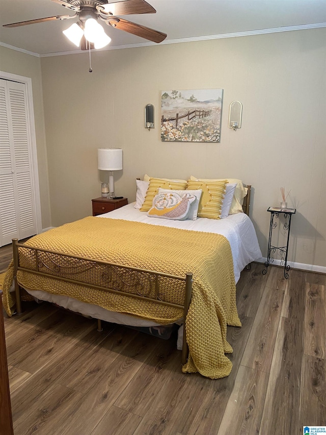 5769 Eastern Valley Rd, Mccalla, AL 35111 - bedroom featuring wood finished floors, ornamental molding, a closet, and a ceiling fan