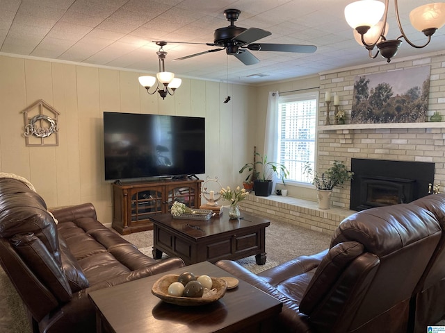 5769 Eastern Valley Rd, Mccalla, AL 35111 - carpeted living area with ornamental molding, a fireplace, a ceiling fan, and a chandelier