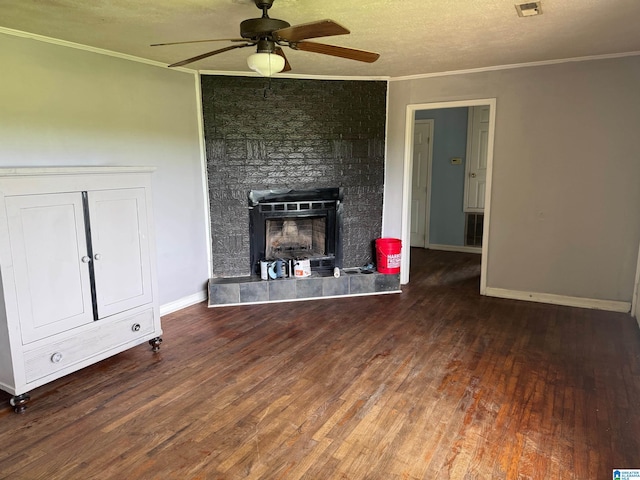1015 Anderson Rd, Gadsden, AL 35901 - unfurnished living room featuring a ceiling fan, wood finished floors, crown molding, a large fireplace, and baseboards