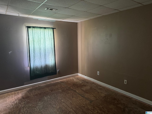 1015 Anderson Rd, Gadsden, AL 35901 - empty room with a paneled ceiling, baseboards, and wood finished floors