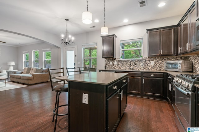 5432 Park Side Cir, Hoover, AL 35244 - kitchen featuring a sink, stainless steel range oven, open floor plan, a breakfast bar area, and dark wood-style flooring