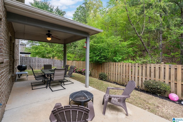 5432 Park Side Cir, Hoover, AL 35244 - fenced backyard featuring a fire pit, ceiling fan, a patio area, outdoor dining space, and a grill