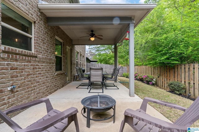 5432 Park Side Cir, Hoover, AL 35244 - fenced backyard with ceiling fan, a fire pit, a patio area, and outdoor dining area