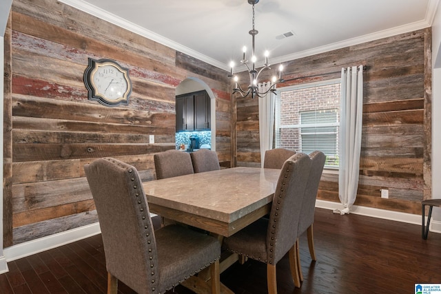5432 Park Side Cir, Hoover, AL 35244 - dining space with baseboards, a chandelier, wooden walls, dark wood finished floors, and arched walkways