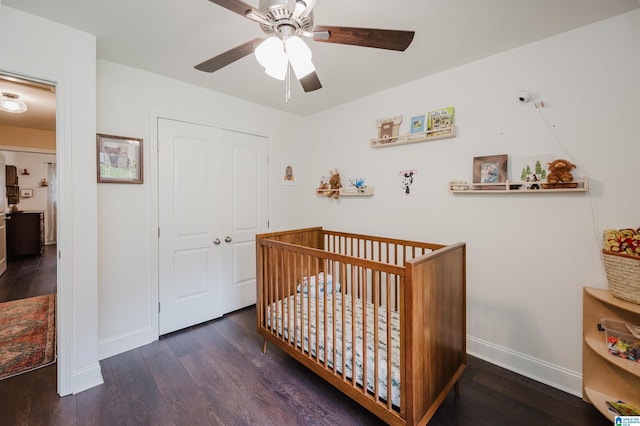 2479 Chuchura Rd, Birmingham, AL 35244 - bedroom with wood finished floors, baseboards, a closet, and a crib