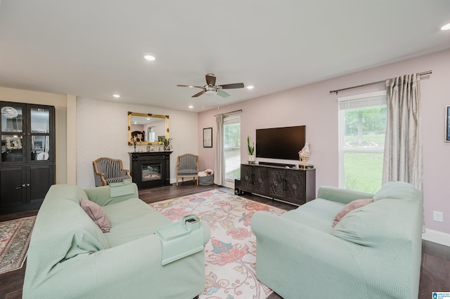 2479 Chuchura Rd, Birmingham, AL 35244 - living room with wood finished floors, a glass covered fireplace, a ceiling fan, and recessed lighting