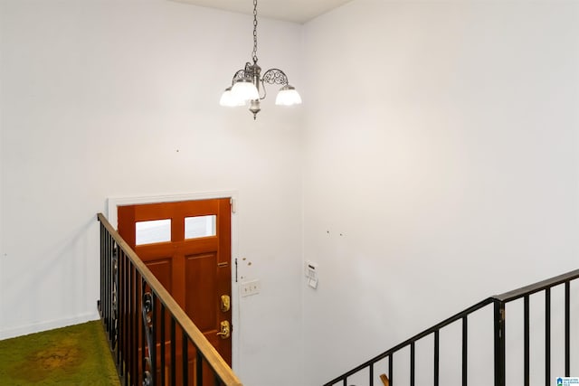 2424 Debbie Dr, Center Point, AL 35215 - staircase with a chandelier, baseboards, and carpet floors