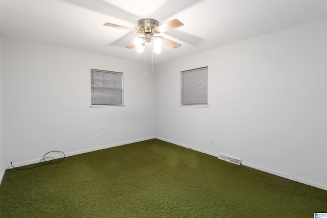 2424 Debbie Dr, Center Point, AL 35215 - empty room with baseboards, dark colored carpet, and ceiling fan