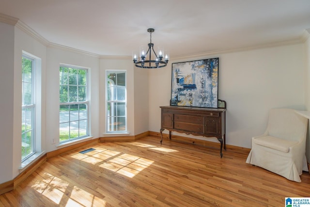 1794 Riverknolle Rd, Tallassee, AL 36078 - living area with a chandelier, plenty of natural light, light wood-style flooring, ornamental molding, and baseboards