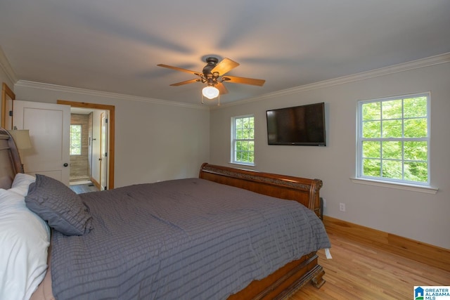 1794 Riverknolle Rd, Tallassee, AL 36078 - bedroom featuring ornamental molding, light wood-style flooring, baseboards, a ceiling fan, and connected bathroom