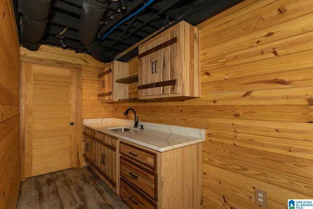 1794 Riverknolle Rd, Tallassee, AL 36078 - kitchen with wood walls, a sink, light countertops, and dark wood finished floors