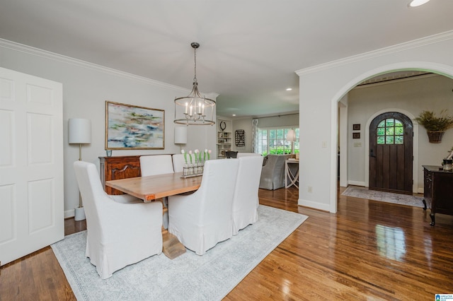 312 La Playa Pl, Homewood, AL 35209 - dining space featuring arched walkways, a chandelier, wood finished floors, ornamental molding, and recessed lighting