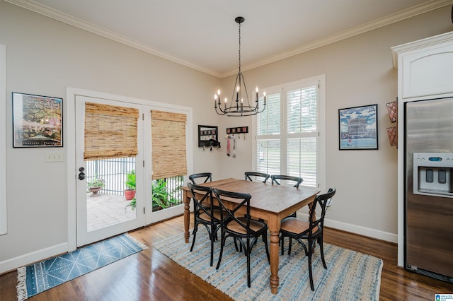 312 La Playa Pl, Homewood, AL 35209 - dining area featuring plenty of natural light, baseboards, crown molding, wood finished floors, and a chandelier