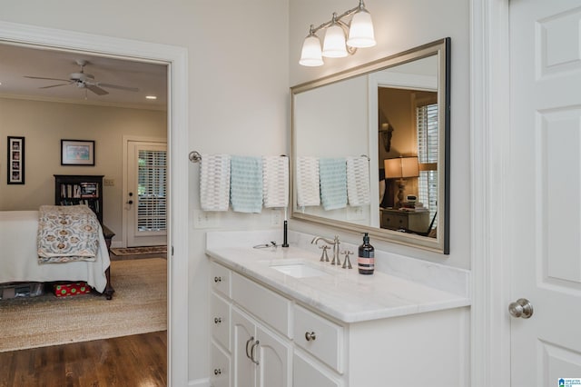 312 La Playa Pl, Homewood, AL 35209 - bathroom featuring vanity, wood finished floors, crown molding, and a ceiling fan