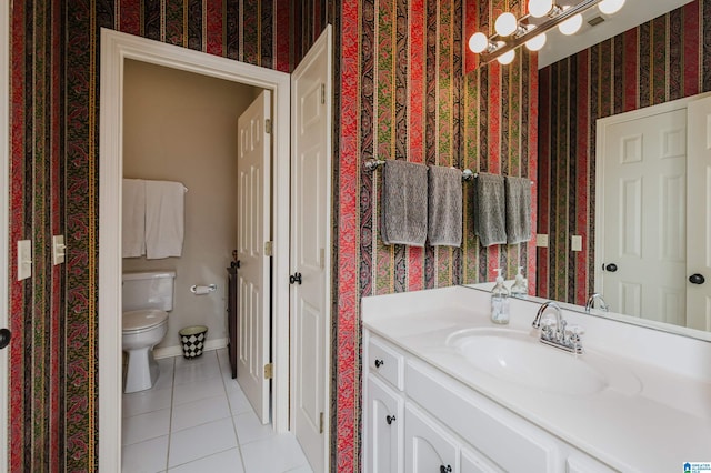 312 La Playa Pl, Homewood, AL 35209 - bathroom with wallpapered walls, tile patterned flooring, vanity, toilet, and baseboards
