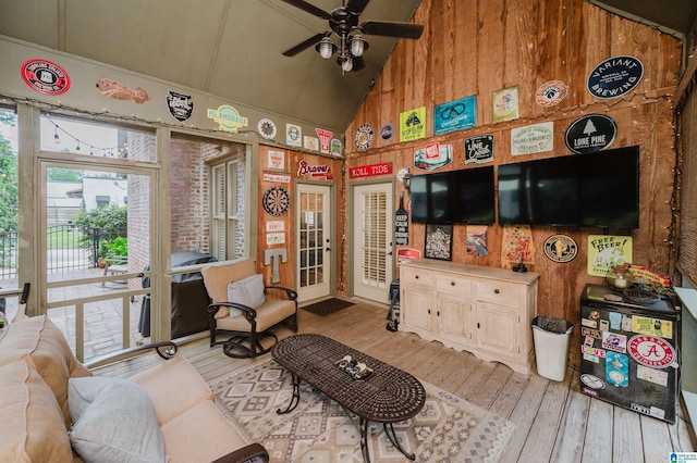 312 La Playa Pl, Homewood, AL 35209 - living area with high vaulted ceiling, light wood-style flooring, a ceiling fan, wood walls, and french doors