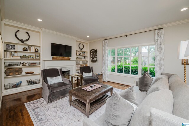 312 La Playa Pl, Homewood, AL 35209 - living area with ornamental molding, a fireplace, wood finished floors, recessed lighting, and built in shelves