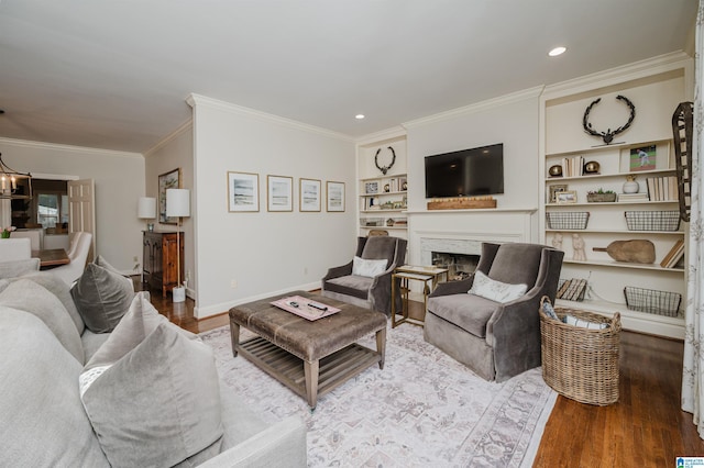 312 La Playa Pl, Homewood, AL 35209 - living area featuring wood finished floors, crown molding, a fireplace, baseboards, and a chandelier