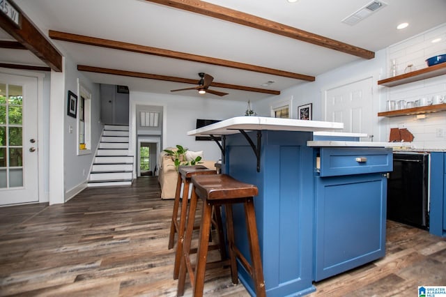 327 County Road 4315, Wedowee, AL 36278 - kitchen featuring blue cabinetry, open shelves, a breakfast bar, beamed ceiling, and light countertops