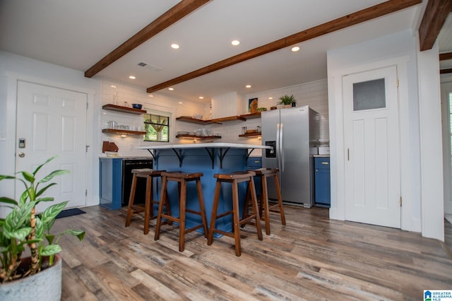 327 County Road 4315, Wedowee, AL 36278 - kitchen featuring open shelves, stainless steel fridge, blue cabinets, beamed ceiling, and a kitchen breakfast bar