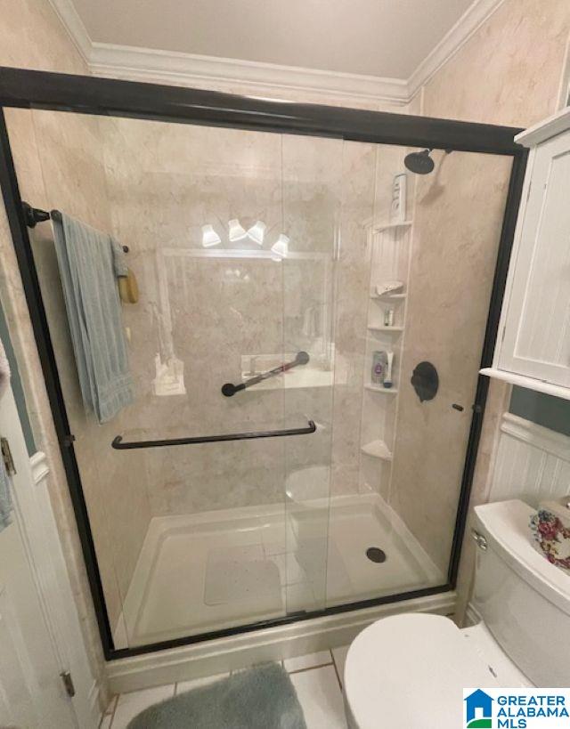 104 Brent Way, Alabaster, AL 35007 - bathroom featuring toilet, crown molding, and a shower stall