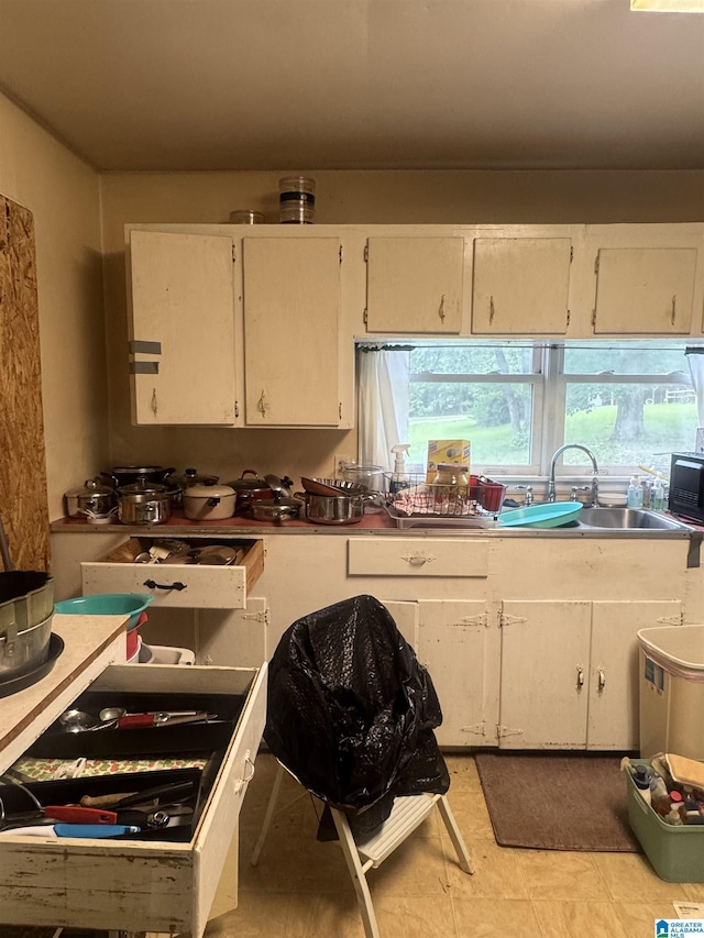 9709 Mize Rd, Remlap, AL 35133 - kitchen with a sink, white cabinets, and black microwave