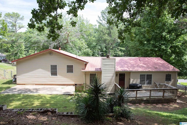 1214 Wildoak Dr, Anniston, AL 36206 - back of house with a wooden deck, metal roof, a chimney, a patio, and crawl space