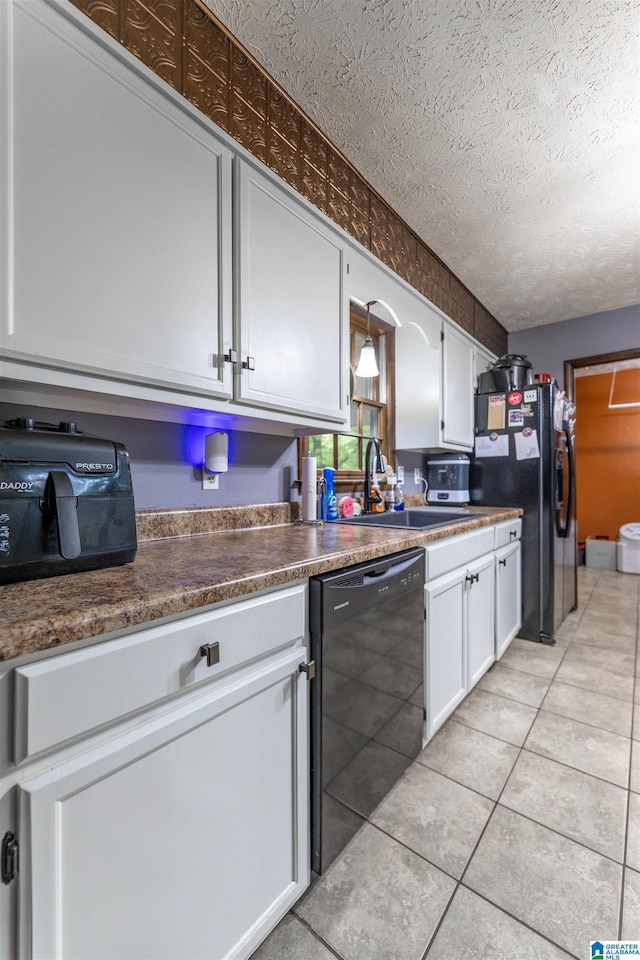 1214 Wildoak Dr, Anniston, AL 36206 - kitchen featuring dishwasher, white cabinets, a sink, stainless steel refrigerator with ice dispenser, and dark countertops