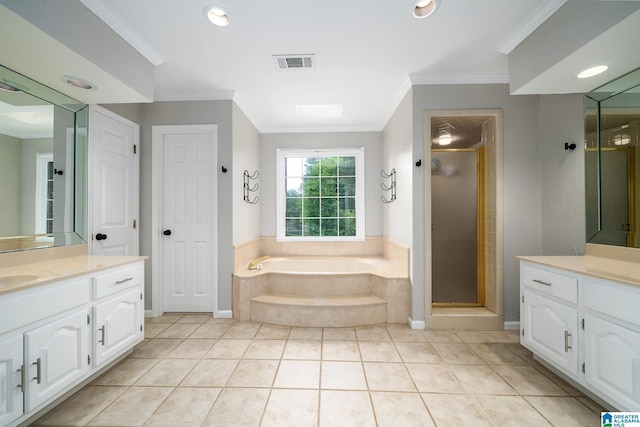 2563 Aspen Cove Dr, Vestavia Hills, AL 35243 - bathroom featuring vanity, crown molding, a garden tub, and a stall shower