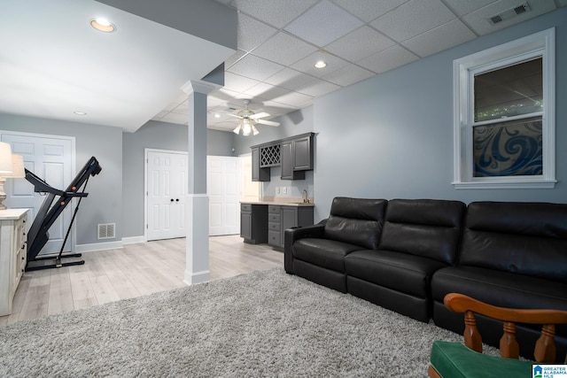 2563 Aspen Cove Dr, Vestavia Hills, AL 35243 - living area featuring light wood-type flooring, ceiling fan, recessed lighting, a paneled ceiling, and decorative columns